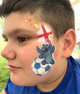 boy with Stitch and England Flag football face paint